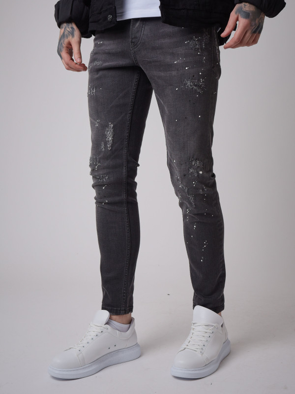 Jeans slim fit gris oscuro desgastados y manchados - Negro