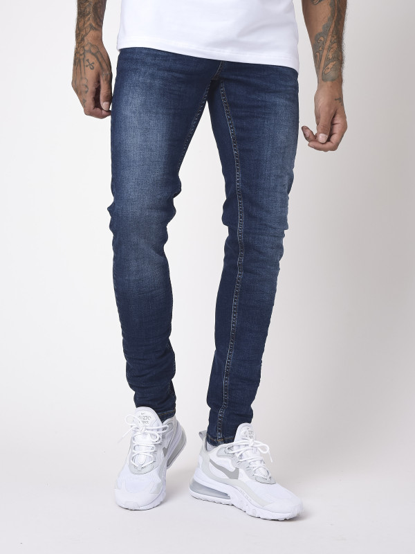 Jeans pitillo básicos azules con efecto arañazo - Azul