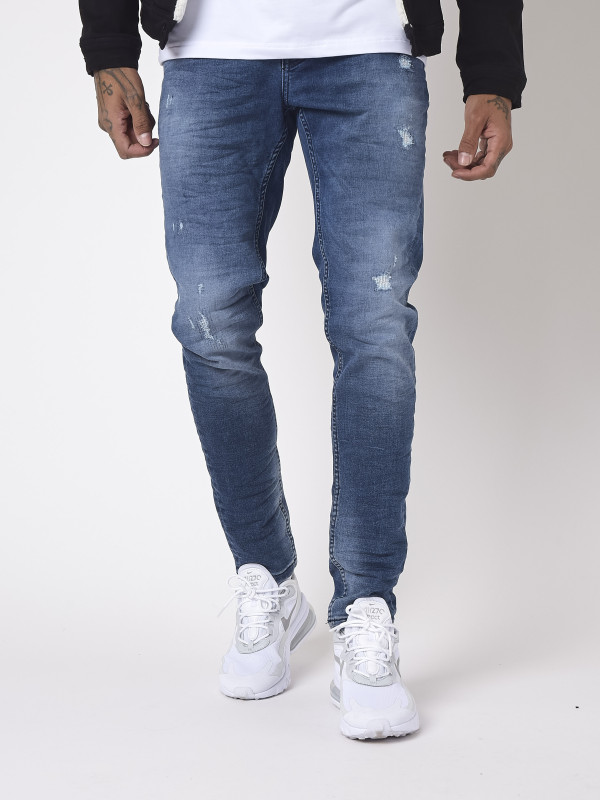 Jeans slim básicos azules con efecto arañazo - Azul