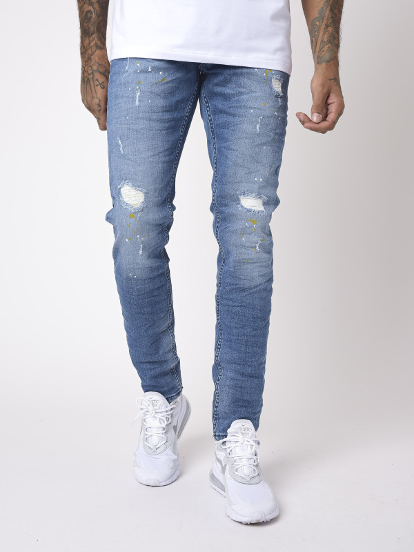Jeans slim básicos azules desgastados y con efecto moteado - Azul